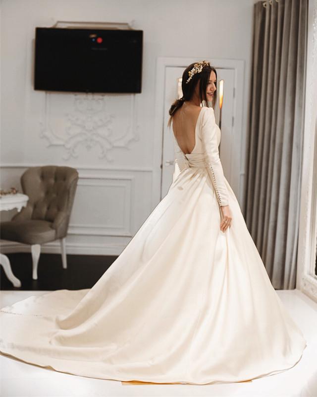 2024 Elegant A Line Satin Long Sleeves Backless Long Train With Buttons Wedding Dresses